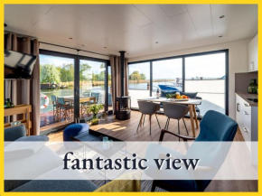 WELL Hausboot 1 - fantastic view with fireplace, barbeque events, sailing tours & beach shuttle service in Peenemünde